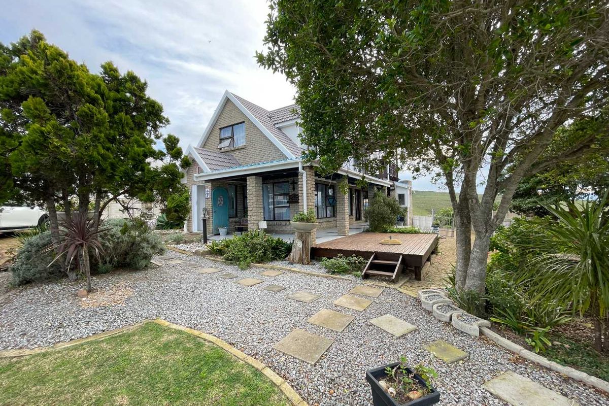 Prestigious Hartenbos Heuwels Home | 4 Bedrooms | Green Belt Views & Exceptional Privacy - Photo 2