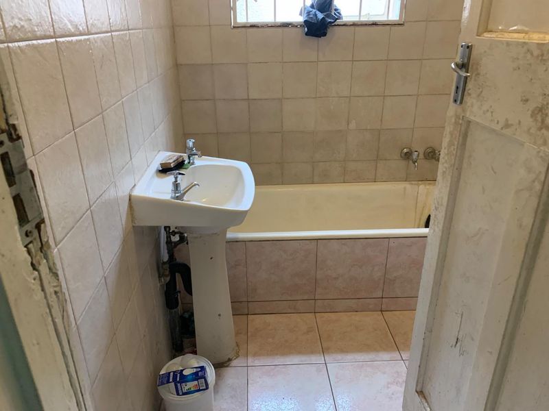 Charming 4-Bedroom Home with Additional Cottages in Rosettenville Rental Income R24k - Photo 9