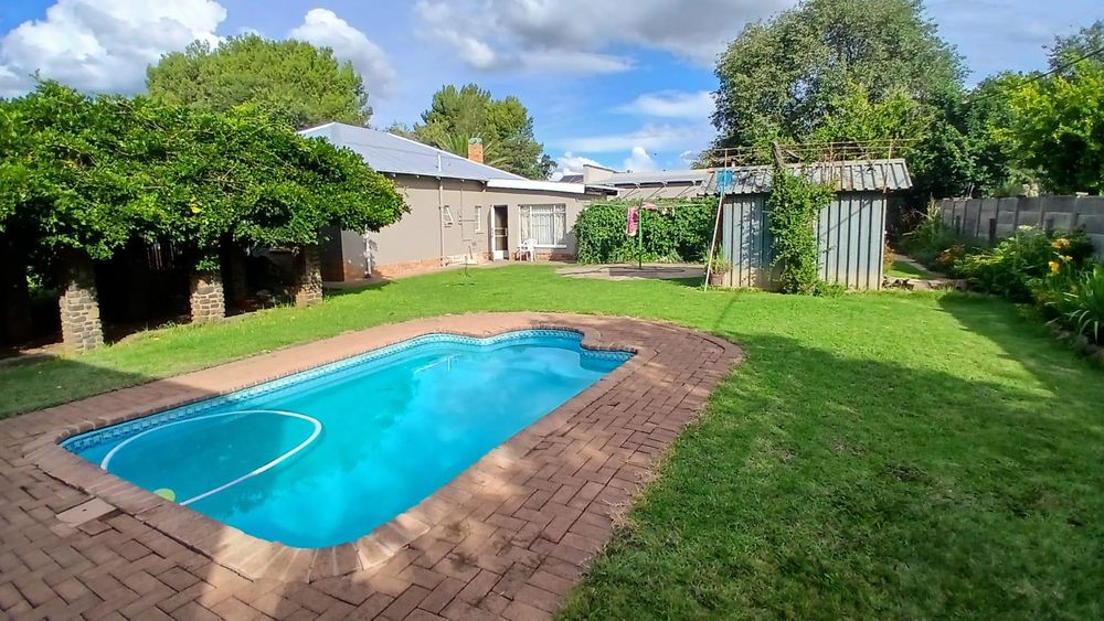 Back view with swimming pool