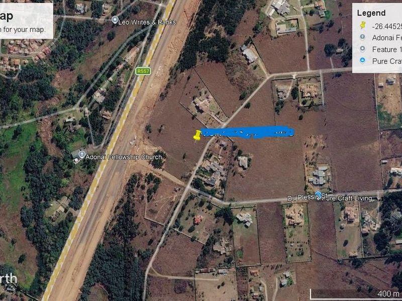 An aerial satellite view of the residential land plot and surrounding neighborhood infrastructure.