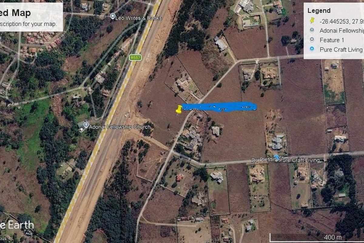 An aerial satellite view of the residential land plot and surrounding neighborhood infrastructure.