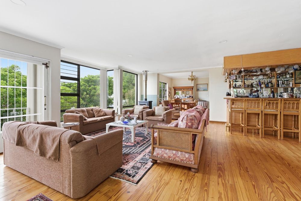 Living and dining area with built in bar offer spectacular views ample natural light 