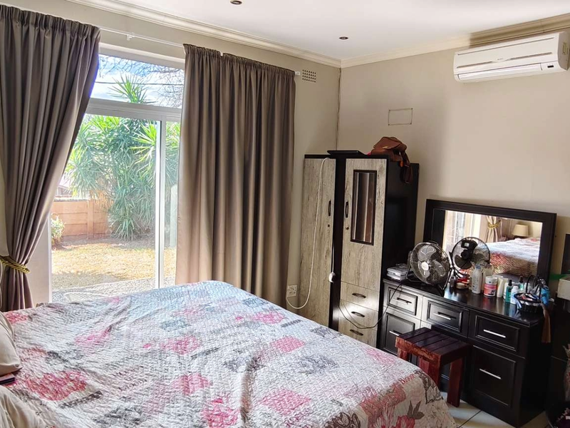 Spacious Family Home with Income-Generating Bachelors Flat on Large Stand - Photo 10