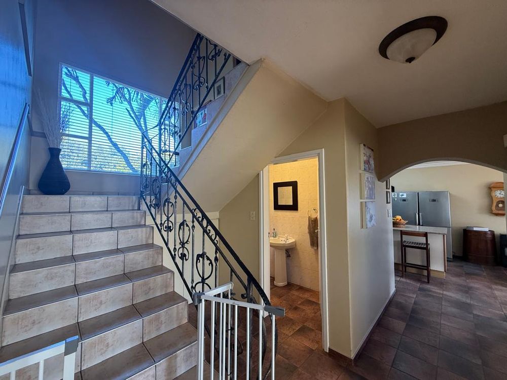 Entrance hallway leading to the guest WC and kitchen