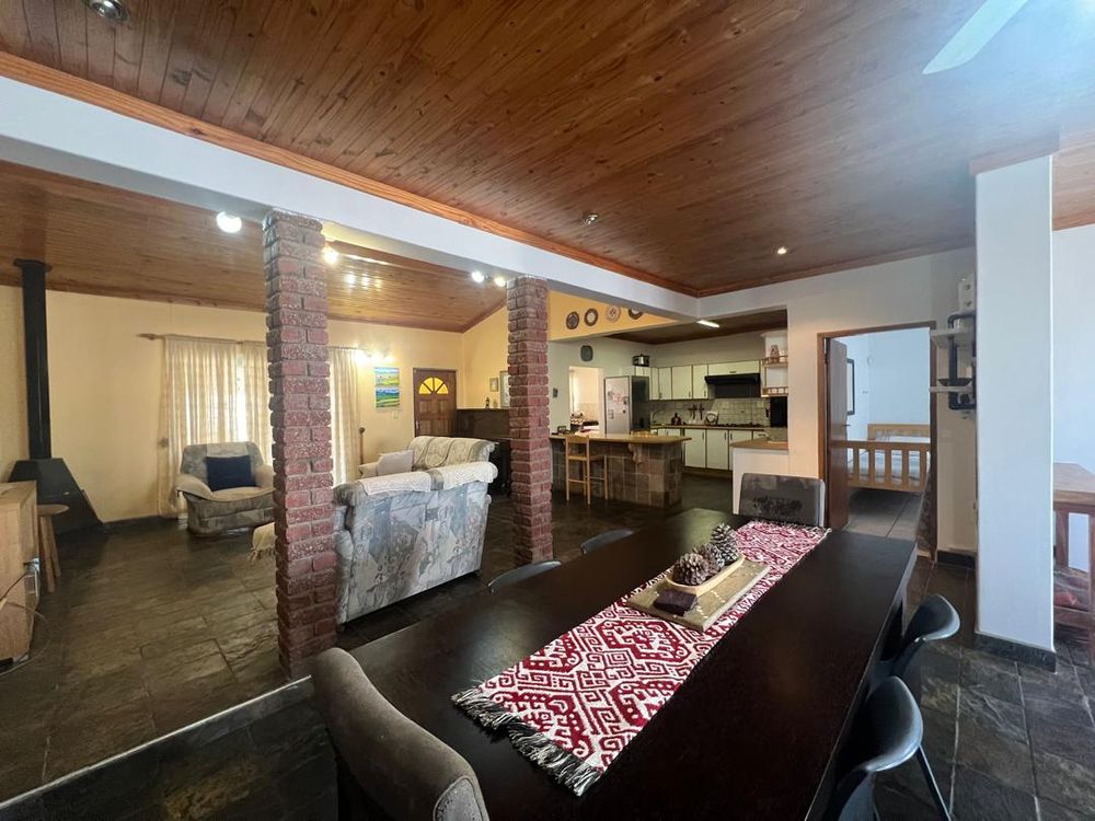 Dining table, lounge and kitchen