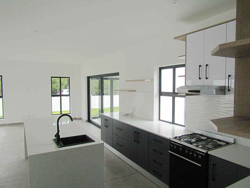 Costal three bedroom home with modern finishes - Photo 10