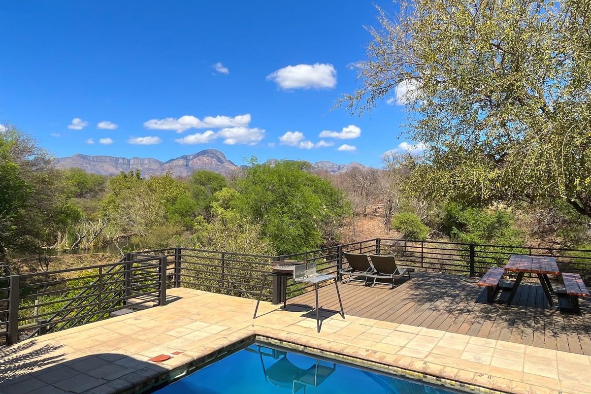 Elegant 5-Bedroom Home with Pool and Mountain Views - Photo 4