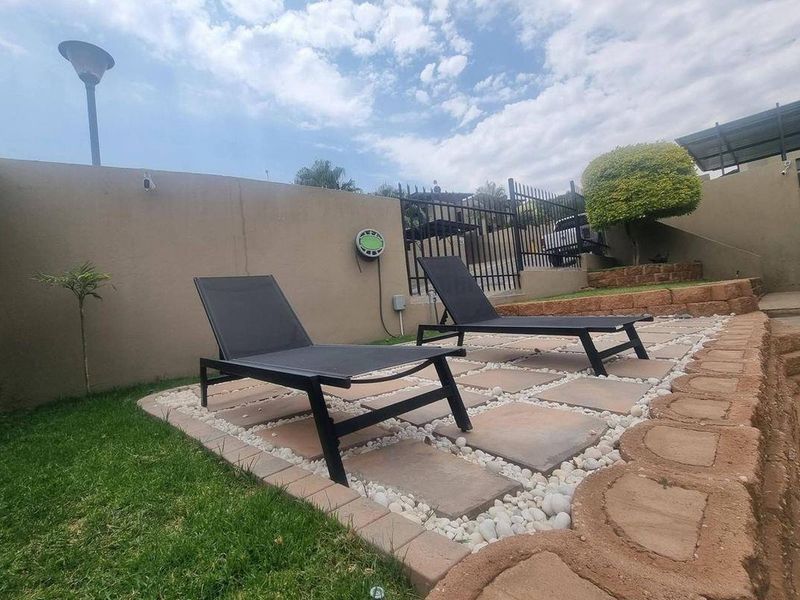 A rare opportunity to own a fully upgraded executive townhouse in the prestigious Henning Village, located in the highly sought-after suburb of Kleine Kuppe. - Photo 2