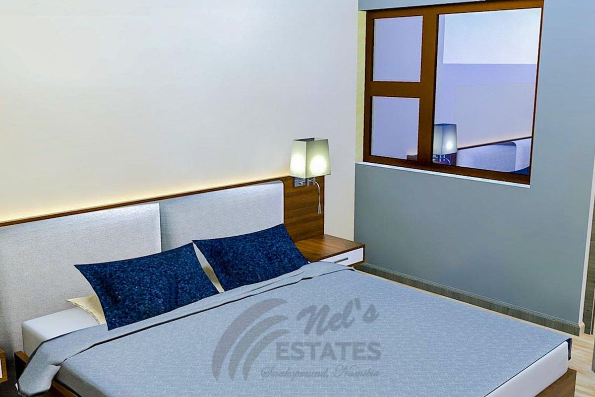 A modern bedroom featuring a built-in headboard with integrated bedside tables and wall-mounted lighting.