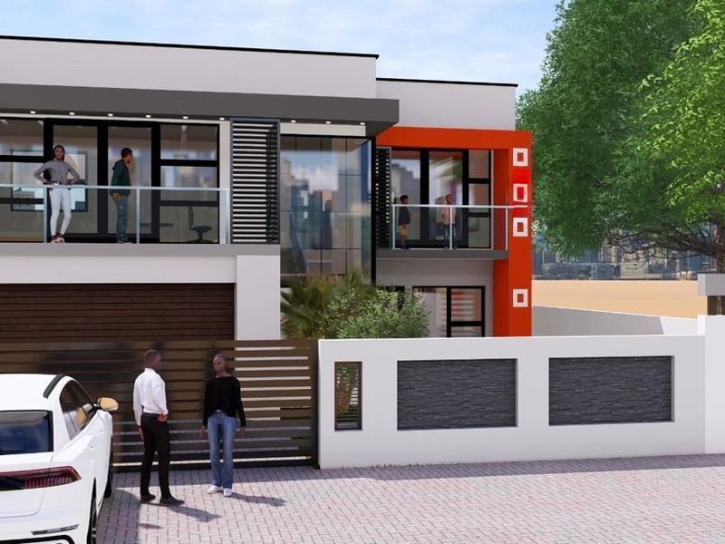 A modern two-story residential facade featuring clean lines, balconies with glass balustrades, and a secure gated entrance with a paved driveway.