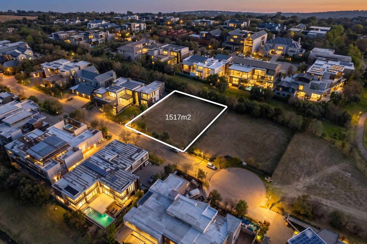 An aerial view of a 1517m2 vacant residential plot situated within a developed estate, highlighting the prime location and surrounding luxury homes.