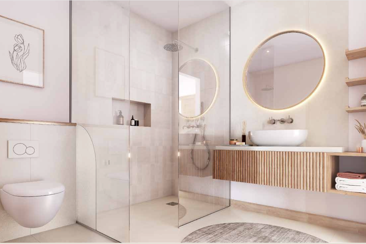 Modern bathroom featuring a wall-mounted toilet, walk-in glass shower, floating vanity with vessel sink, and illuminated circular mirror.