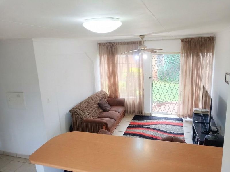 Exceptionally Secure Two-Bedroom Townhouse with Private Garden Retreat - Photo 5