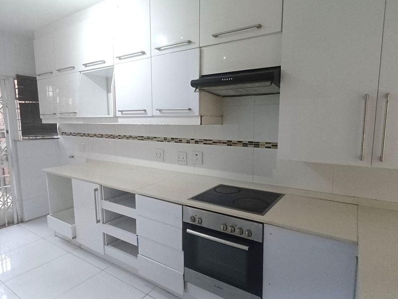 Spacious, Affordable Double-Storey Living with Patio & Pool - Photo 3