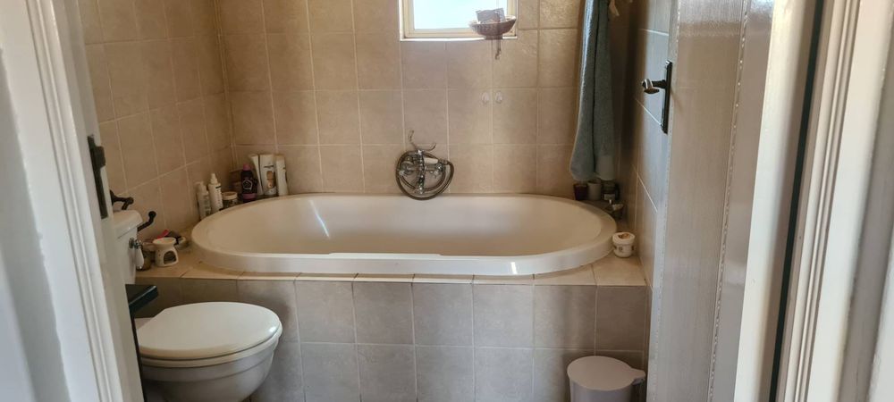 main bathroom with bath and shower