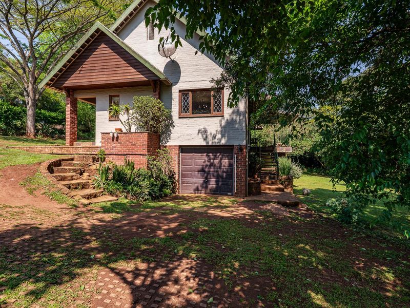 CHARACTER FILLED FAMILY HOME TUCKED AWAY IN A LUSH GARDEN - Photo 5