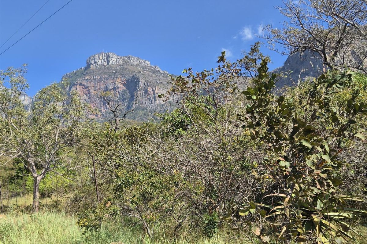 A scenic view of the rugged mountain range and natural landscape surrounding the vacant residential property.