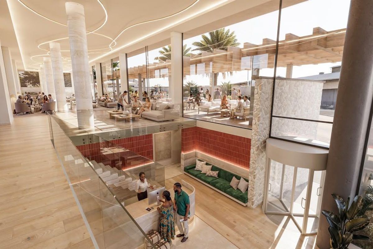 Modern penthouse entrance lobby featuring a reception desk, stone accents, floor-to-ceiling glass windows, and high-end architectural finishes.