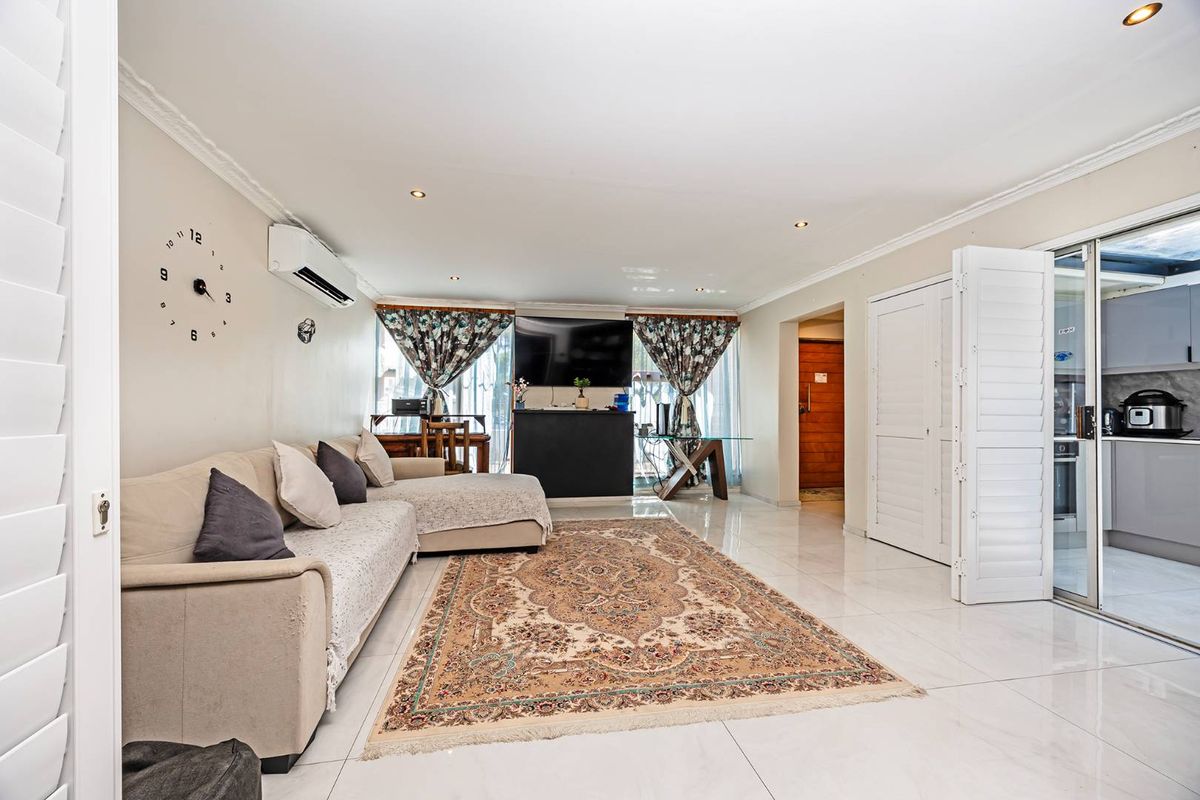 Striking Modern Family Home with Designer Finishes and Effortless Entertaining in Prime Panorama - Photo 2