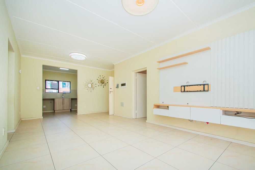 Lounge with kitchen in background