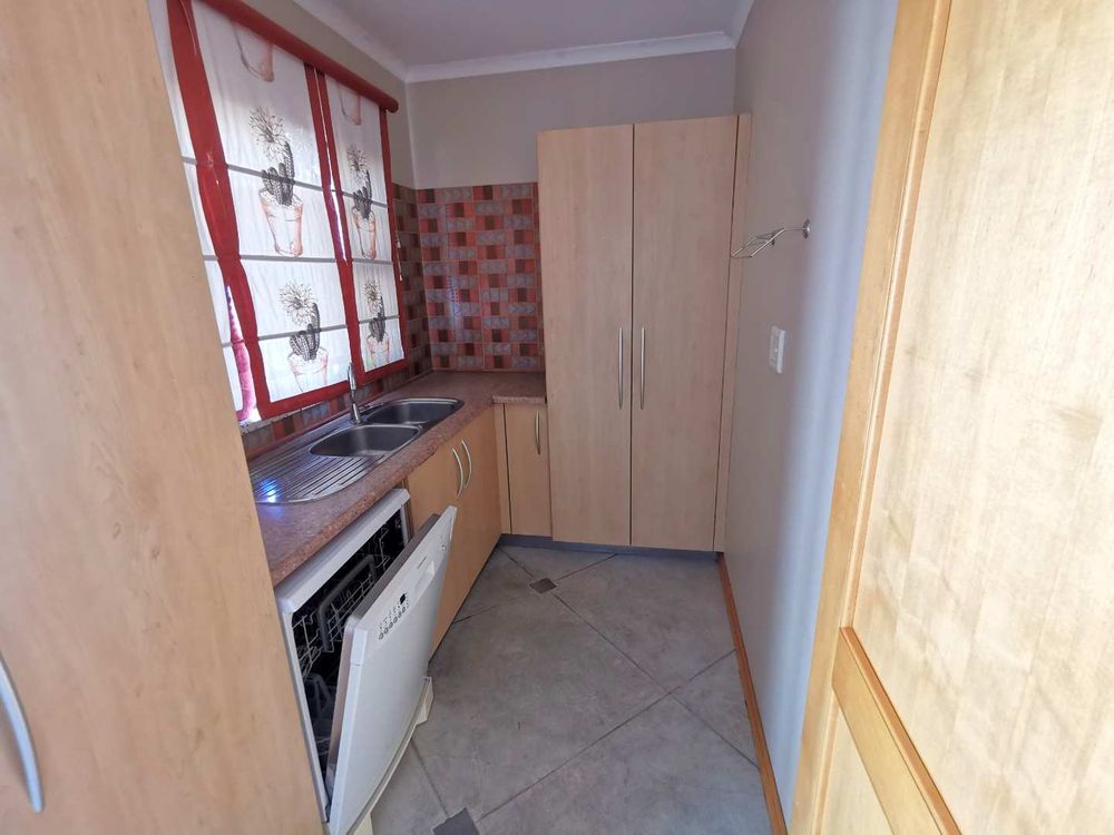 1ST FLOOR SCULLERY /LAUNDRY ROOM NEXT TO THE OPEN-PLAN KITCHEN 