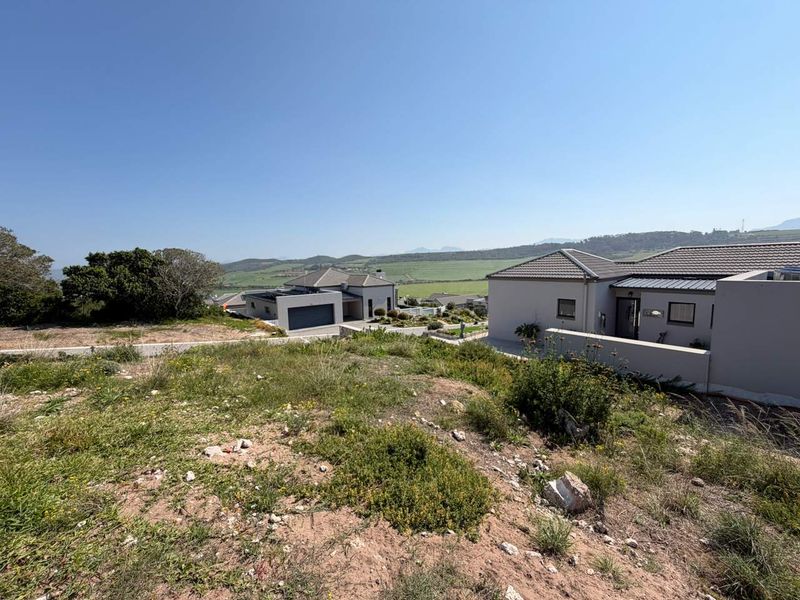 A view from the vacant residential land looking out over the surrounding neighborhood and distant landscape.