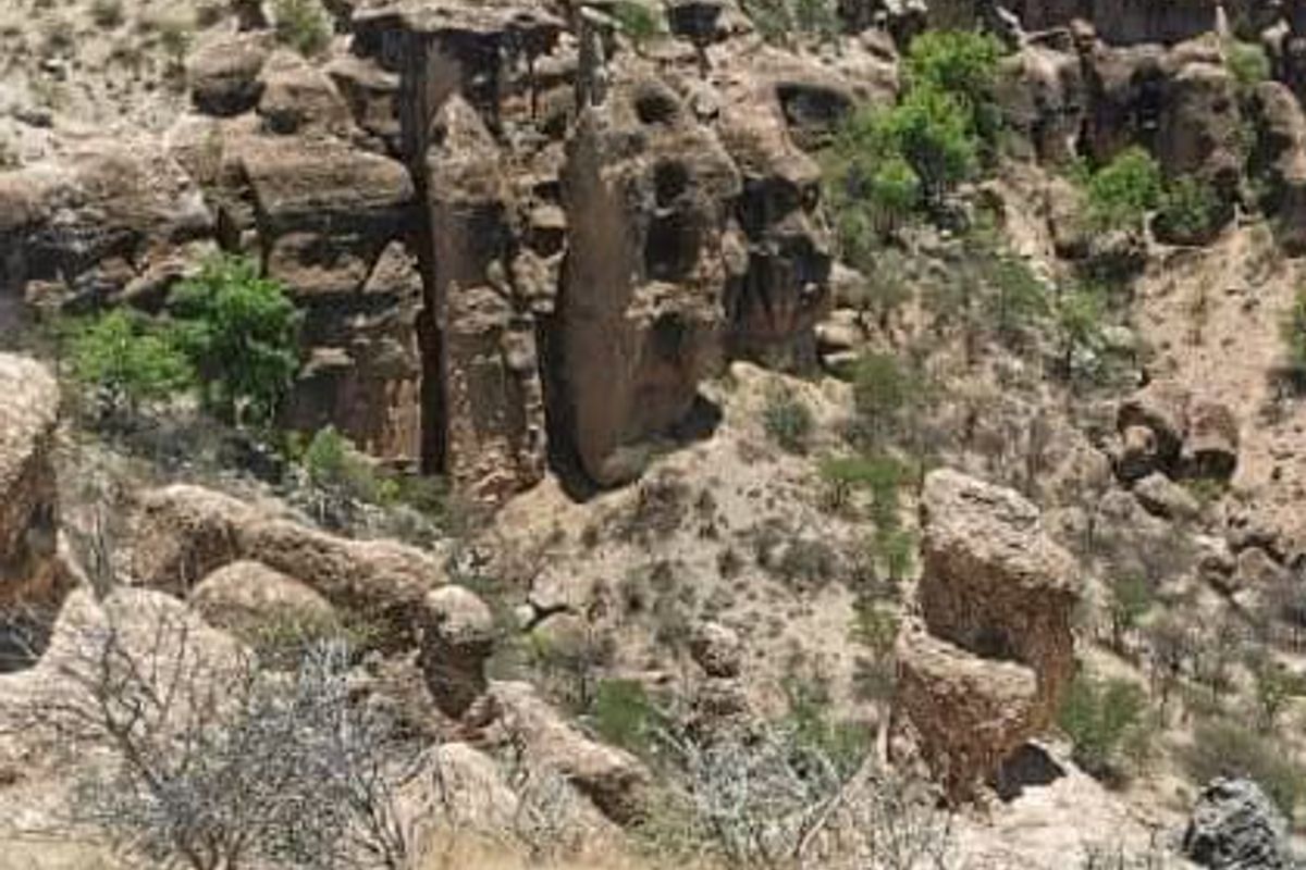 A scenic view of the natural rocky landscape and rugged terrain characteristic of the farm property.