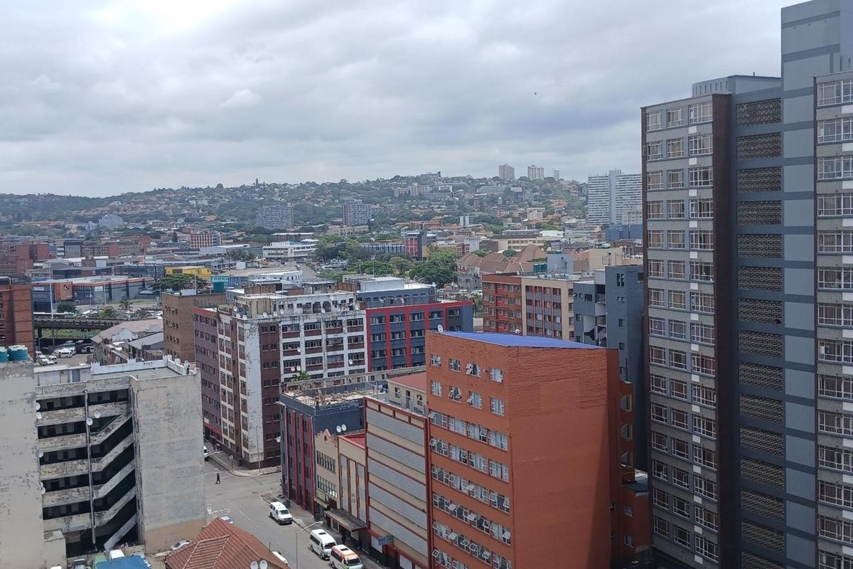 An elevated urban cityscape view overlooking surrounding apartment buildings and city infrastructure.