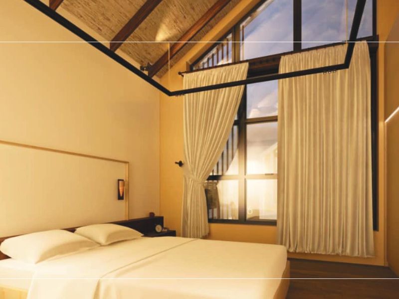 A modern bedroom featuring a high vaulted ceiling with exposed timber beams, large windows, and integrated lighting.