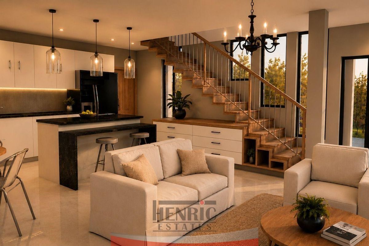 Modern open-plan living area featuring a sleek kitchen with island, integrated under-stair storage, and a contemporary staircase, creating a cohesive and functional living space.