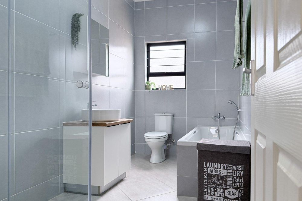 Family bathroom with both shower and bath.