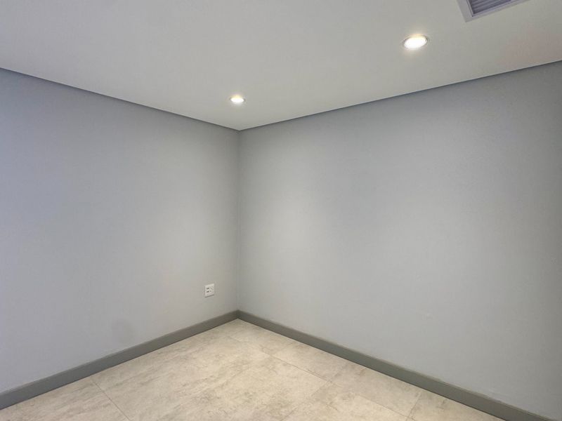 This is a premium, move-in-ready coastal apartment that combines luxury, security, and modern convenience in a sleek, never-before-lived-in space. - Photo 9