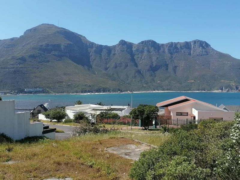 A scenic view overlooking the coastal bay and surrounding mountain range from the residential property.
