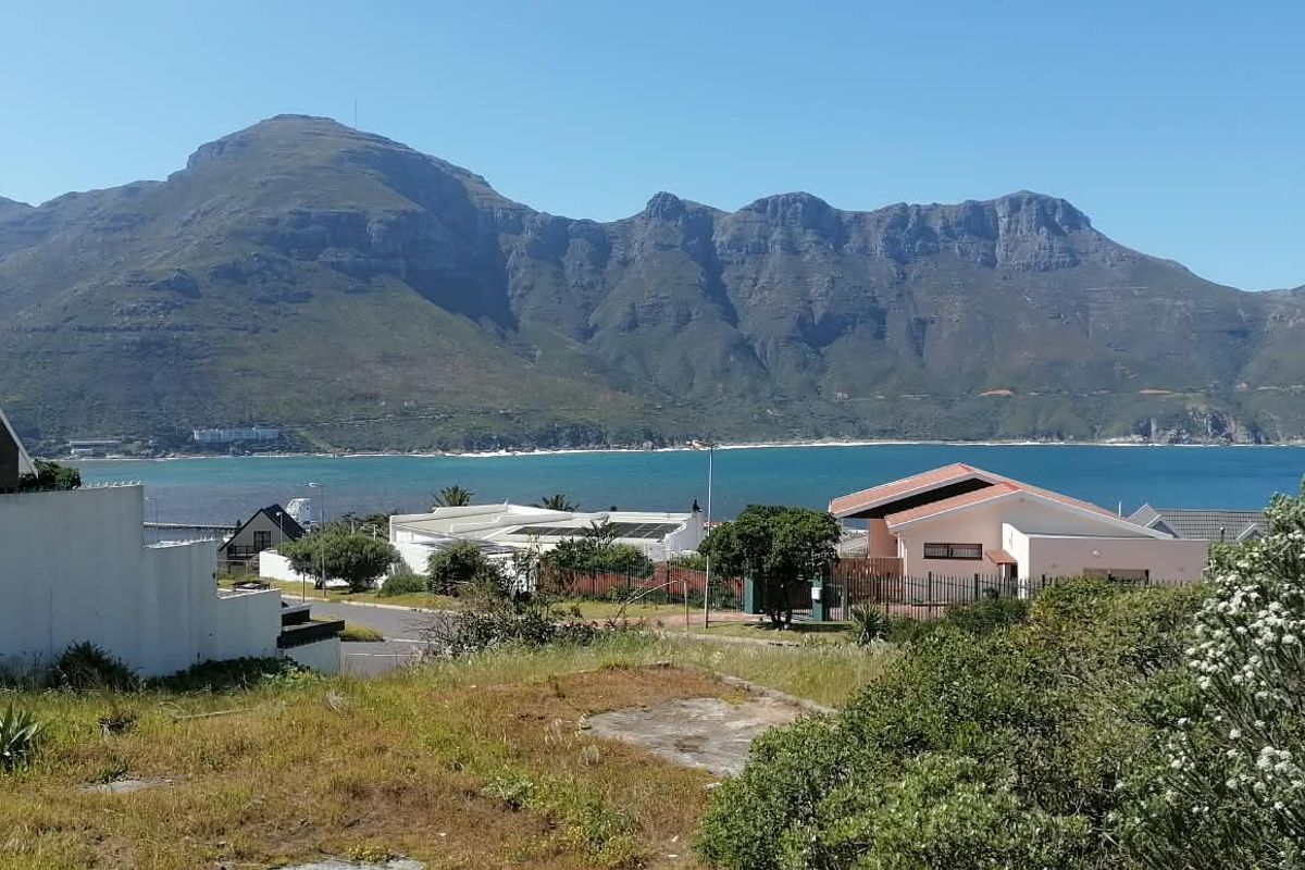 A scenic view overlooking the coastal bay and surrounding mountain range from the residential property.
