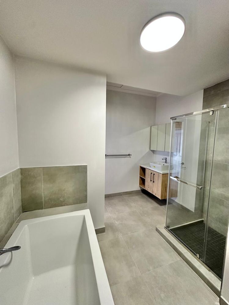 Bathroom with shower and bath