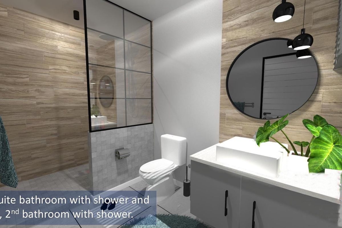 Modern bathroom featuring a glass-enclosed walk-in shower, vanity with countertop basin, and contemporary wall tiling.