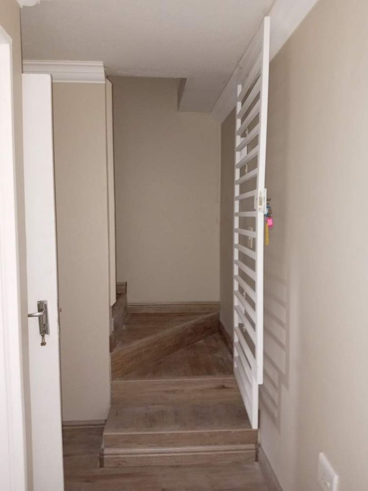 Stairs to the 2nd floor with security steel gate