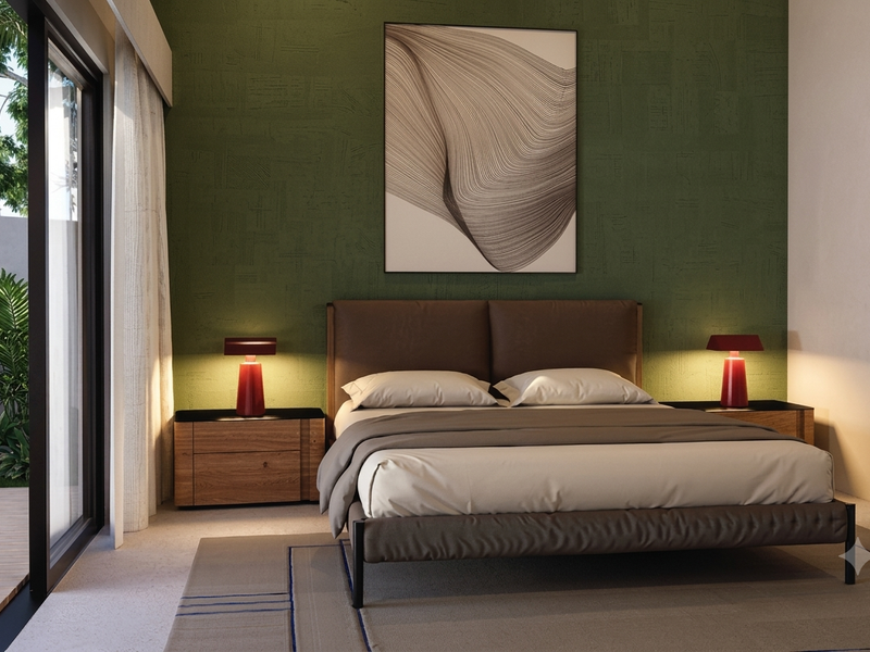 A modern bedroom featuring a textured green accent wall and large sliding glass doors providing direct access to an outdoor patio area.
