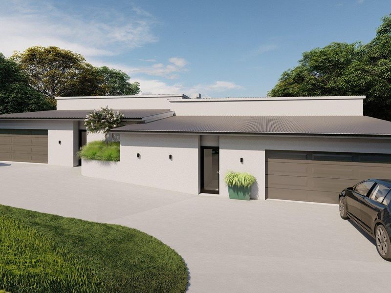 Modern front elevation featuring a clean facade, double garage, and a spacious concrete driveway.