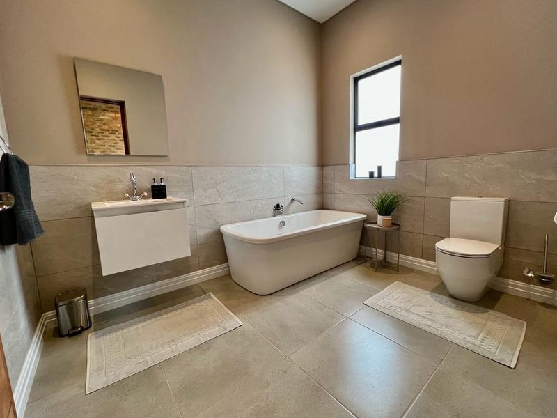INCOME GENERATING HOME Welcome to this charming 4 bedroom home nestled within Highland Gate Golf Estate - Photo 9