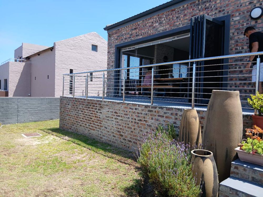 Spacious front Balcony - accessing Living Area via stack doors (currently opened).