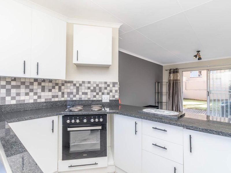 Spacious 1 Bedroom Townhouse with Expansive Private Garden | Sunrock Village Gem - Photo 8