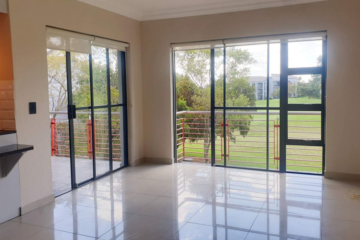 Swing Into Style: Sunlit 1st Floor Haven with Designer Kitchen in Golf Estate - Photo 2