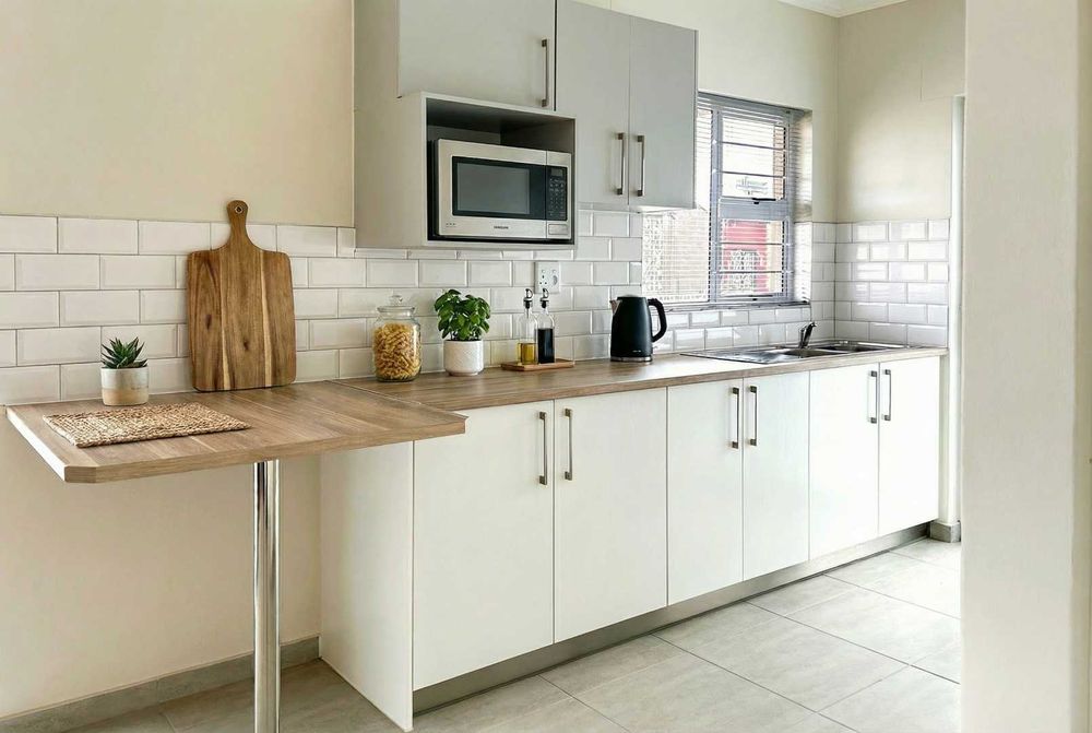 Modern kitchen with built-in cupboards and built-in oven.