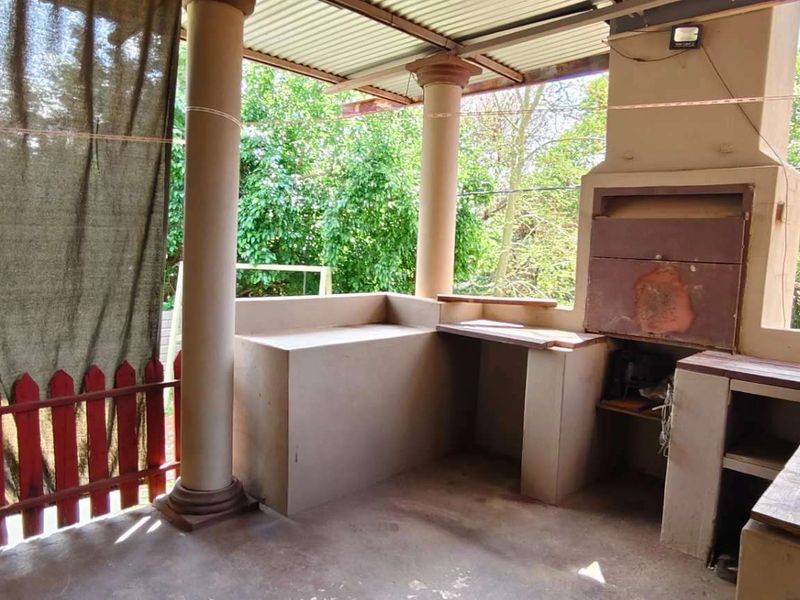 Spacious Family Home with Income-Generating Bachelors Flat on Large Stand - Photo 9
