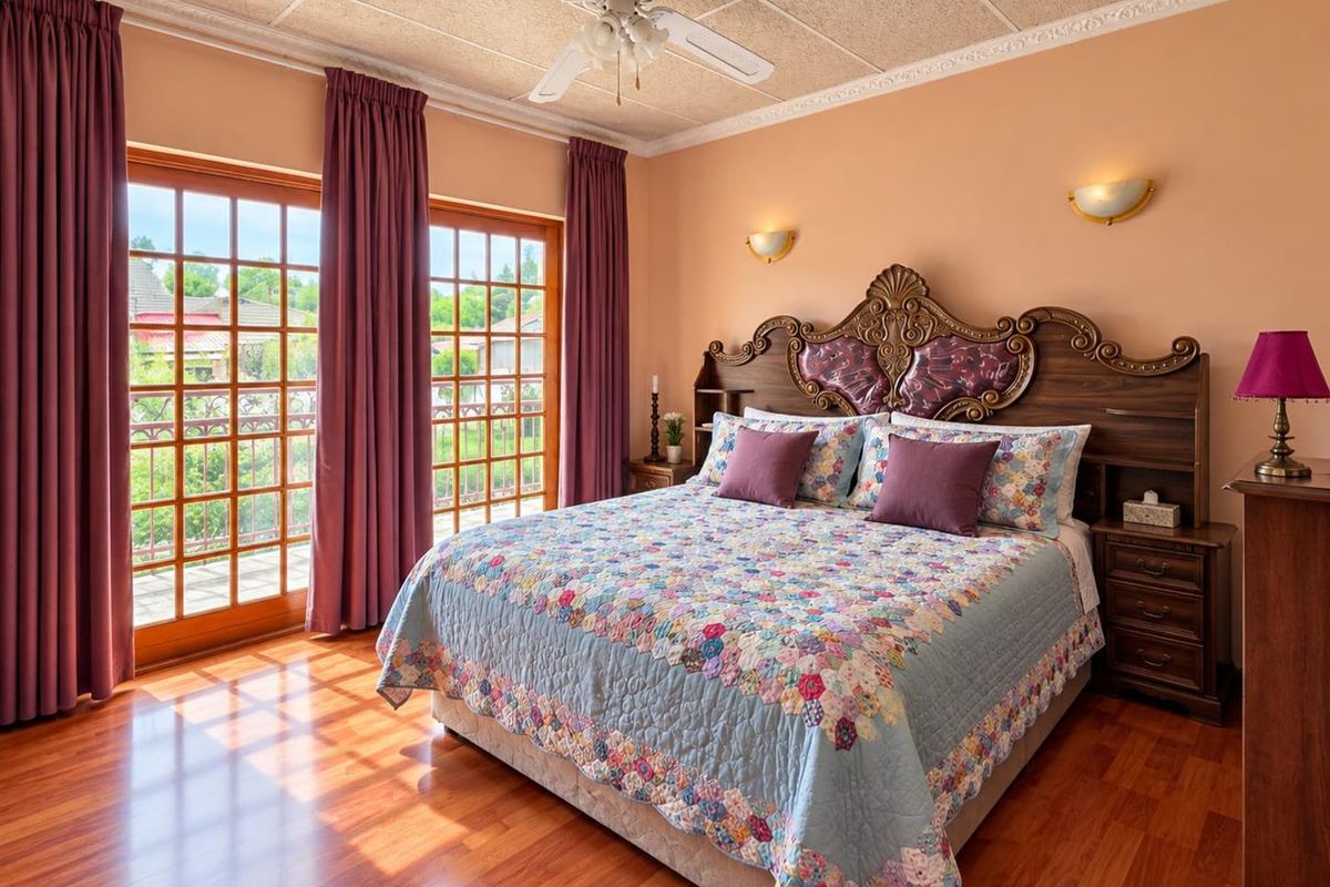 Spacious bedroom featuring laminate flooring, crown molding, a ceiling fan, and double french doors providing access to an outdoor area.