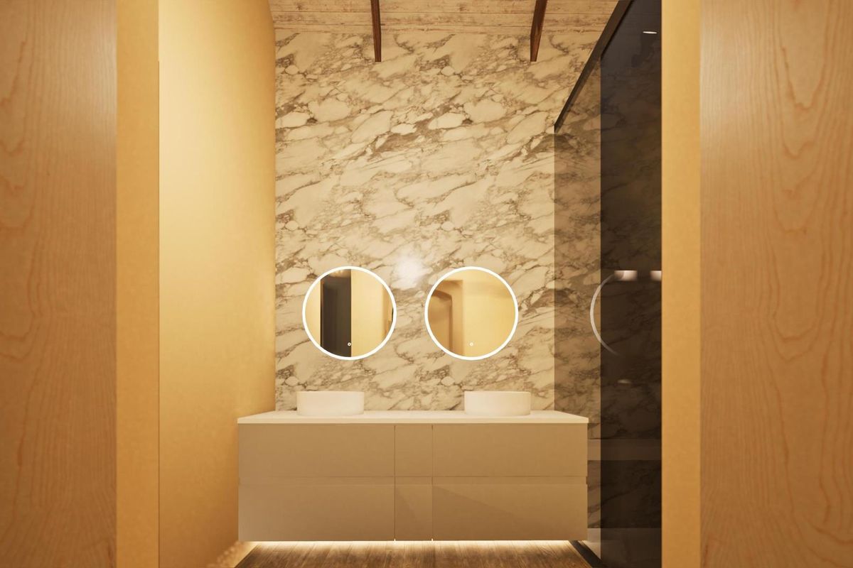 Modern bathroom featuring a double vanity with vessel sinks, marble-look wall tiling, and integrated LED circular mirrors.