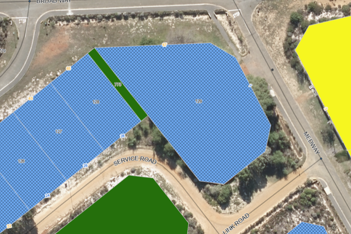 An aerial view showing the layout and boundaries of the property plot in relation to surrounding roads.