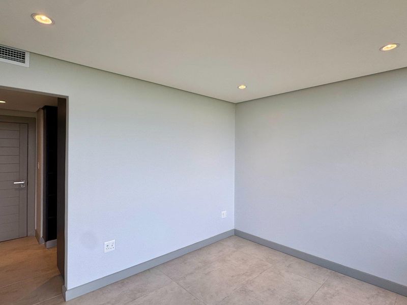 This is a premium, move-in-ready coastal apartment that combines luxury, security, and modern convenience in a sleek, never-before-lived-in space. - Photo 8