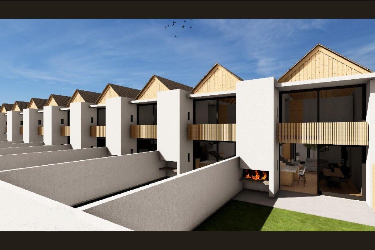 A 3D architectural rendering of a row of modern townhouses featuring private rear patios with built-in fireplaces and upper-level balconies.